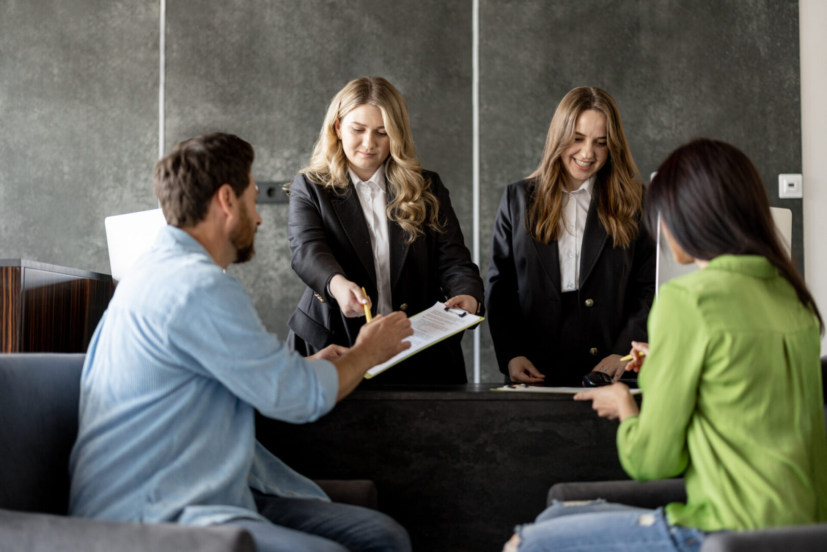Business meeting at reception counter